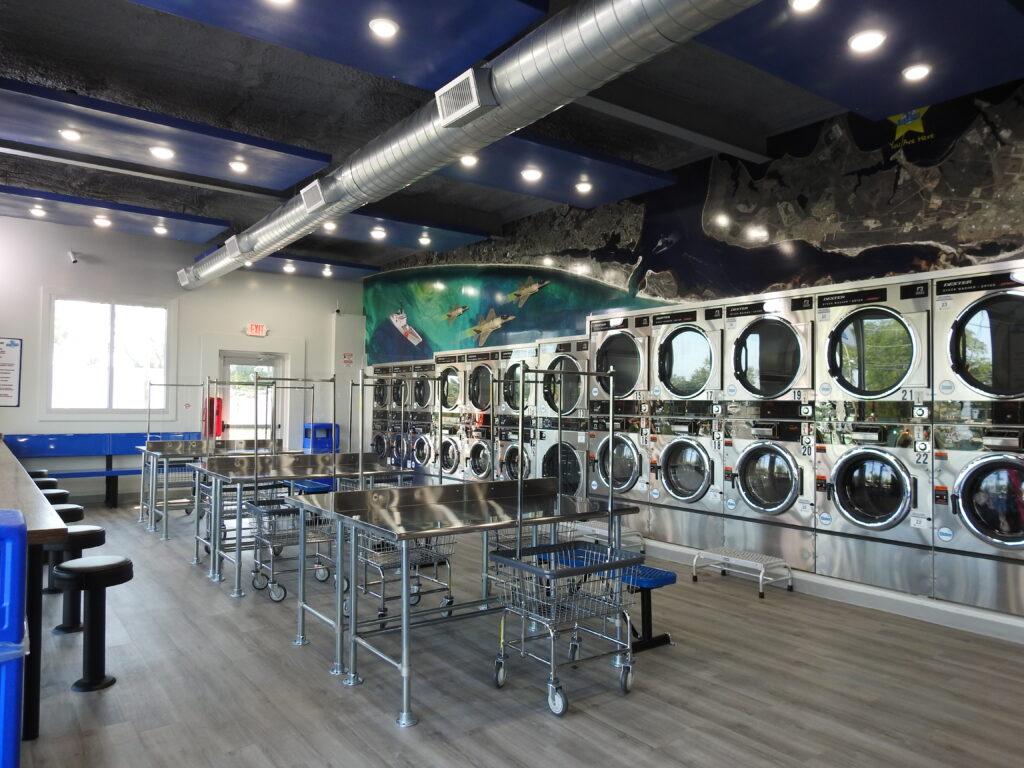 View of coin operated washers and dryers - image 2