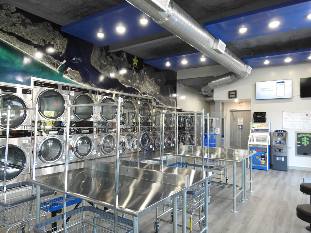 View of coin operated washers and dryers - image 1